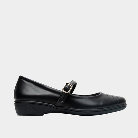 Black leather Mary Jane flat with quilted toe cap detail and low wedge heel, shown in side profile on a white background.