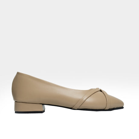 Beige leather pointed-toe flat with crisscross knot strap detail