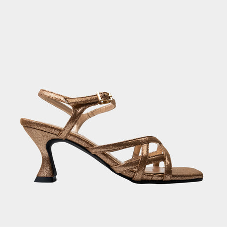 Nude metallic strappy sandal with crisscross toe straps and 2.5-inch flared spool heel